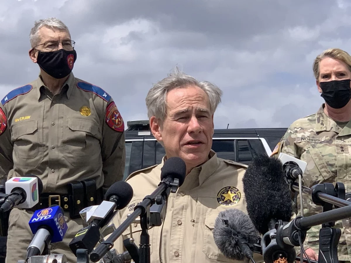 Anti-immigrant governor Greg Abbott, a Republican Extremist, with Colonel Mc-Graw, chief of the Department of Public Safety 